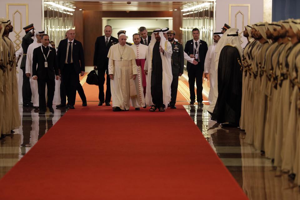 Pope Francis is welcomed by Abu Dhabi's Crown Prince Sheikh Mohammed bin Zayed Al Nahyan, upon his arrival at the Abu Dhabi airport, United Arab Emirates, Sunday, Feb. 3, 2019. Francis travelled to Abu Dhabi to participate in a conference on interreligious dialogue sponsored the Emirates-based Muslim Council of Elders, an initiative that seeks to counter religious fanaticism by promoting a moderate brand of Islam. (AP Photo/Andrew Medichini, Pool)