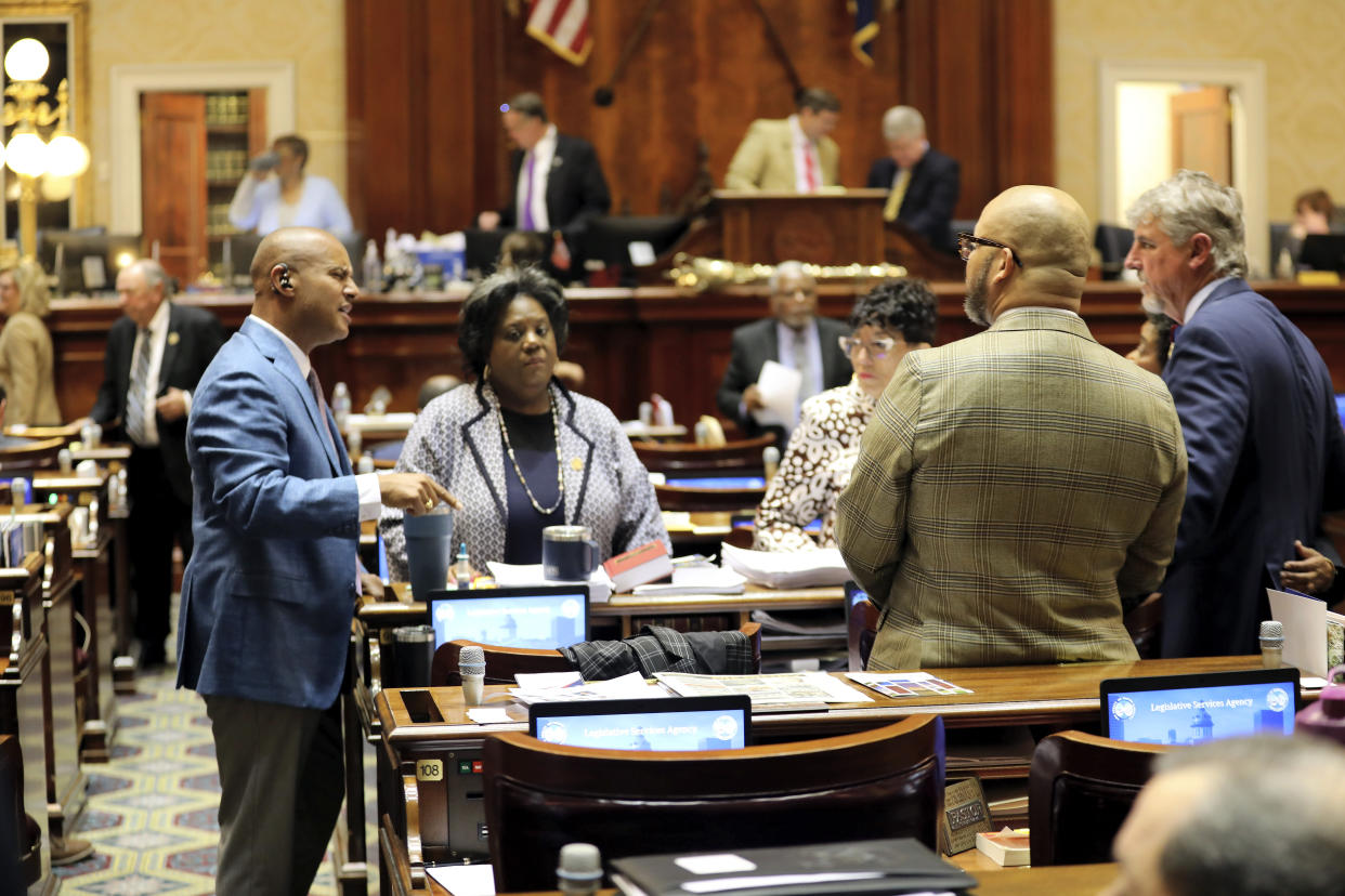From left to right, South Carolina House Minority Leader Todd Rutherford, D-Columbia; Chandra Dillard, D-Greenville; Pat Henegan, D-Bennettsville; John King, D-Rock Hill, and Roger Kirby, D-Lake City, discuss the Democratic strategy before the House restarted its debate on an abortion bill on Wednesday, May 17, 2023, in Columbia, S.C. (AP Photo/Jeffrey Collins)