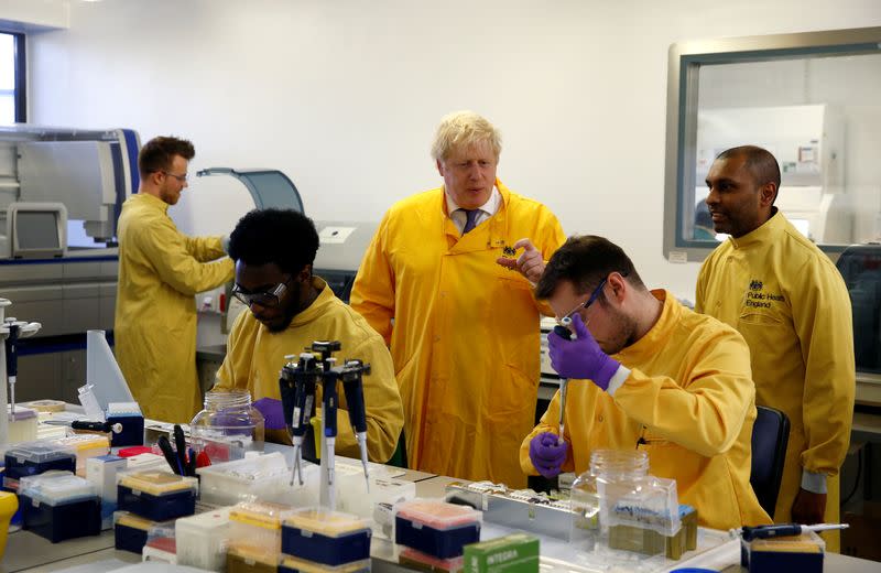 Britain's Prime Minister Boris Johnson visits a laboratory at the Public Health England National Infection Service in Colindale, north London