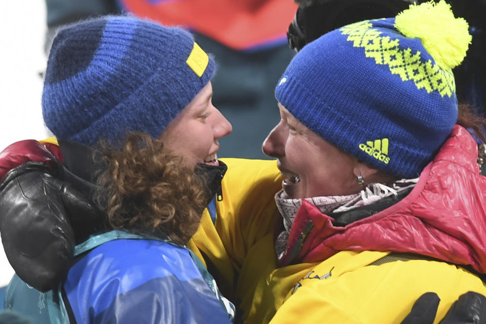 Hanna &Ouml;berg and her mother celebrate after she&nbsp;wins gold in the women's 15km individual biathlon event on&nbsp;Feb. 15.