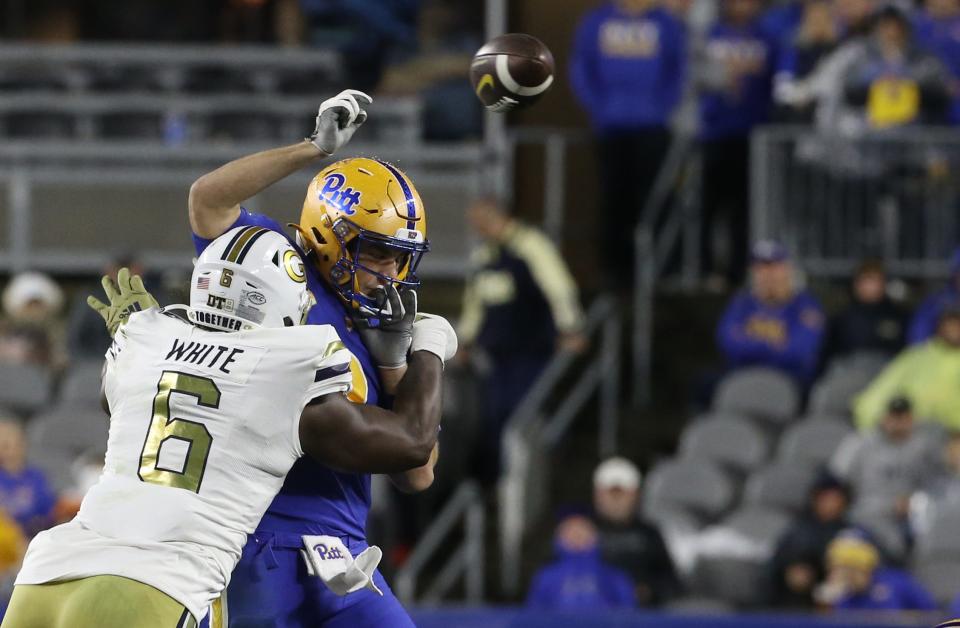 Georgia Tech defensive lineman Keion White forces Pittsburgh quarterback Kedon Slovis to throw an incomplete pass during the second quarter at Acrisure Stadium.