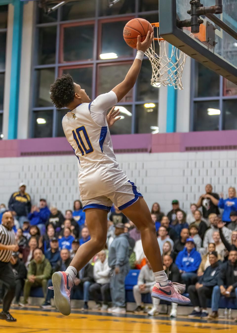 Ajay Lopes (10) of Wareham High School has an uncontested layup after a steal during the first quarter of Friday evening's game against Lynn Voc-Tech.