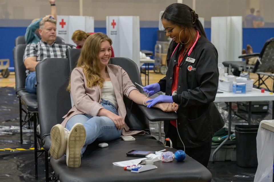 In this October 2022 file photo, Middle Tennessee State University senior Lydia Suggs, left, gives blood in the Campus Recreation Center Gym with assistance from Jada Douglas from the American Red Cross during the annual friendly blood drive competition between MTSU and Western Kentucky University. The 2023 "100 Miles of Hope" competition runs from Monday, Sept. 25, through Wednesday, Sept. 27.