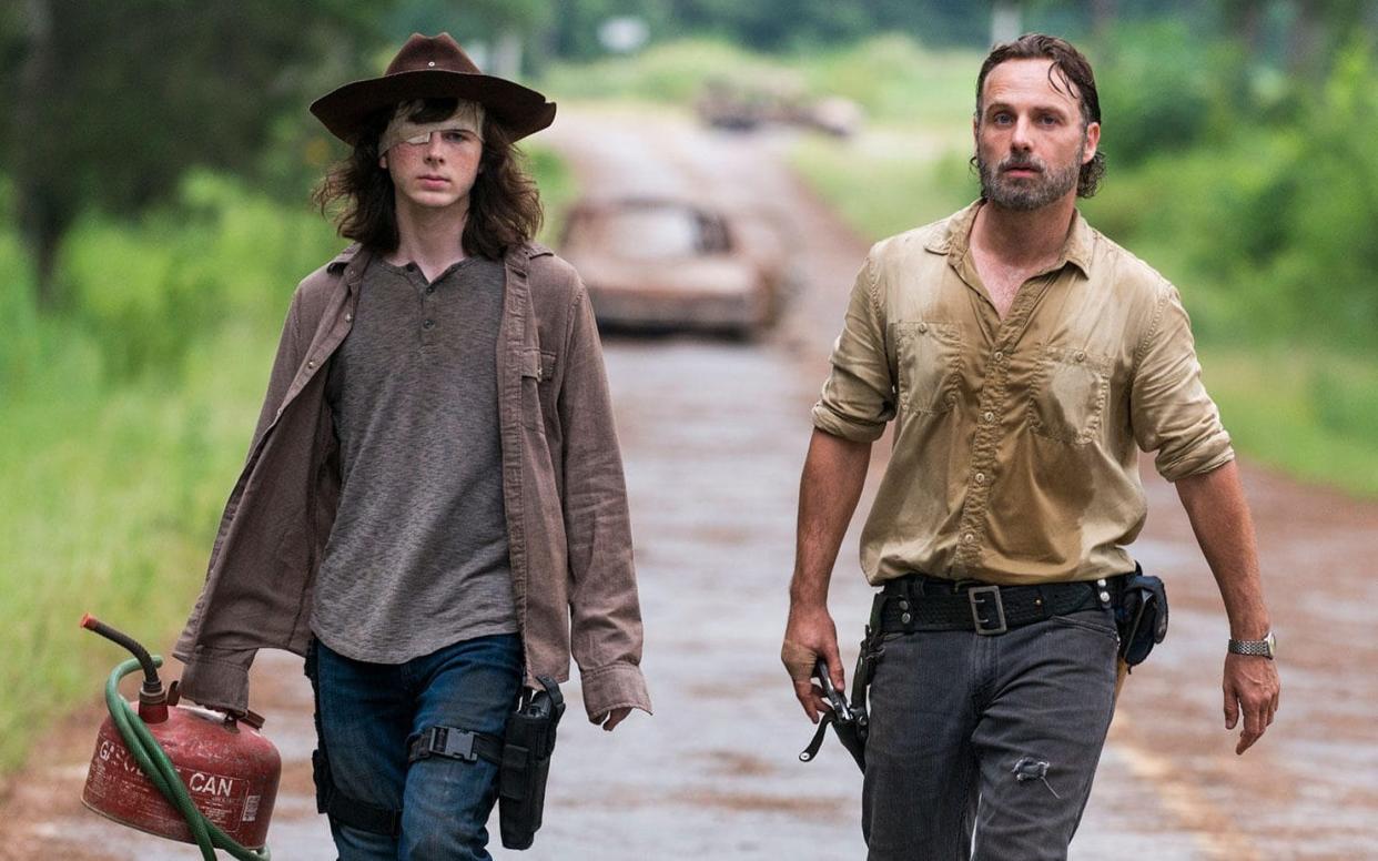 Chandler Riggs and Andrew Lincoln in The Walking Dead - © 2017 AMC Film Holdings LLC. All Rights Reserved.