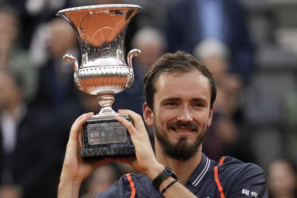 Daniil Medvedev of Russia lifts the trophy after defeating Denmark's Holger Rune during the men's final tennis match at the Italian Open tennis tournament in Rome, Italy, Sunday, May 21, 2023. (AP Photo/Alessandra Tarantino)