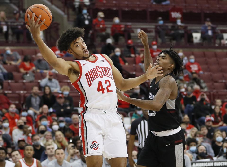 Ohio State Buckeyes forward Harrison Hookfin (42) grabs a rebound from Indianapolis Greyhounds forward Jakobie Robinson (23) during the second half of the NCAA exhibition basketball game at Value City Arena in Columbus on Monday, Nov. 1, 2021. 