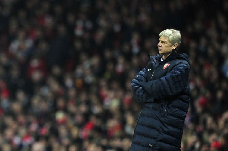 Arsenal manager Arsene Wenger watches the action from the touchline during the UEFA Champions League clash with Bayern Munich on February 19, 2013. Wenger admitted that his team had been "a bit nervous", after a 3-1 home loss