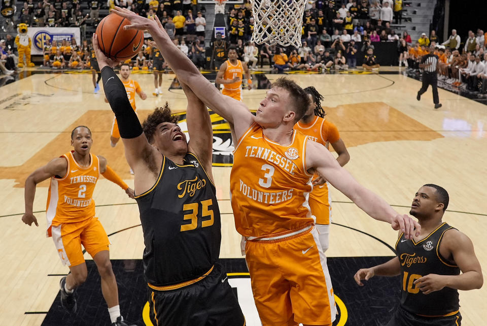 Tennessee guard Dalton Knecht (3) blocks a shot by Missouri forward Noah Carter (35) during the second half of an NCAA college basketball game Tuesday, Feb. 20, 2024, in Columbia, Mo. Tennessee won 72-67. (AP Photo/Charlie Riedel)