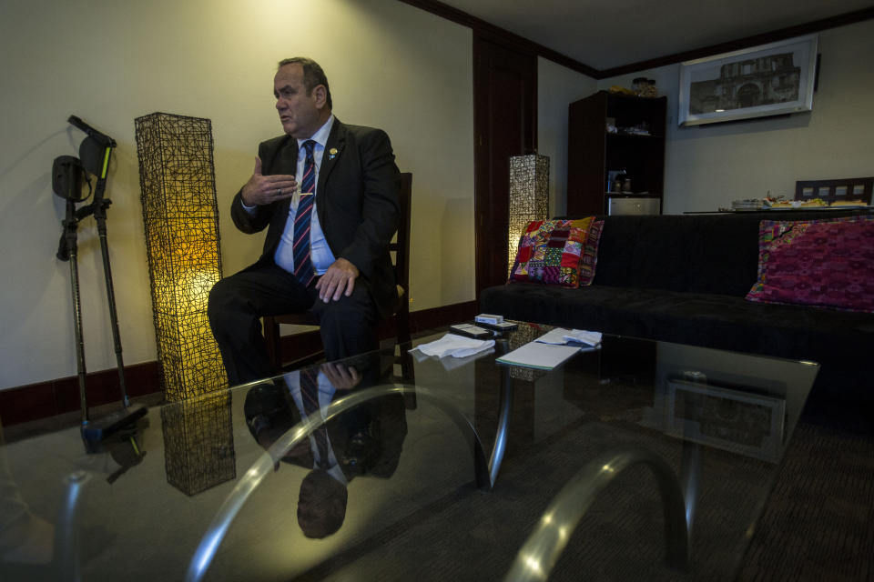 Guatemala's President-elect Alejandro Giammattei gives an interview in Guatemala City, Tuesday, Aug. 13, 2019. Giammattei said Tuesday that his country isn’t able to hold up its side of an immigration agreement with the United States or serve as a “safe third country” for asylum seekers. (AP Photo/Oliver de Ros)