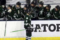 Boston forward Sophie Shirley (9) is congratulated for a goal against Montreal during the third period of a PWHL playoff hockey game Tuesday, May 14, 2024, in Lowell, Mass. (AP Photo/Mark Stockwell)