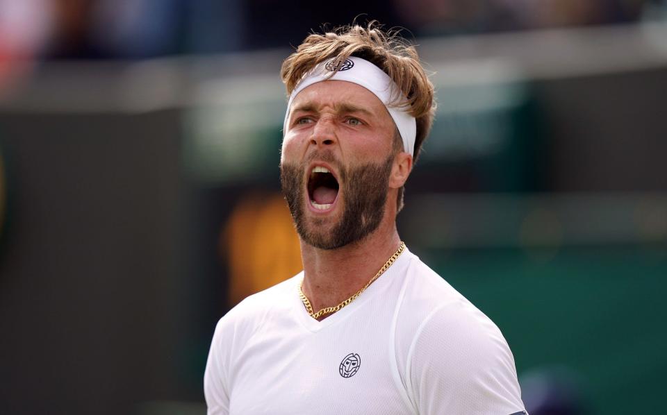 Liam Broady celebrates winning the fourth set during their Gentlemen's singles second round match against Diego Schwartzman on day four of the 2022 Wimbledon Championships at the All England Lawn Tennis and Croquet Club, Wimbledon. - PA