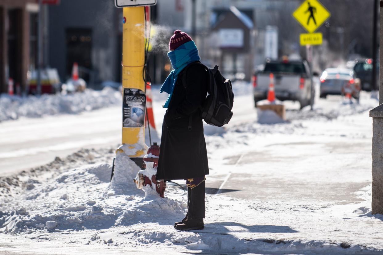 A pedestrian braves the cold on January 30, 2019 in Minneapolis, Minnesota. - Bitter cold with temperatures lower than Antarctica gripped the American Midwest on Wednesday, grounding flights, closing schools and businesses and raising frostbite and hypothermia fears for homeless residents. (Photo by STEPHEN MATUREN / AFP)        (Photo credit should read STEPHEN MATUREN/AFP via Getty Images)