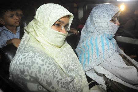 Relatives of Islamist leader Abdul Quader Mollah sit in a vehicle leaving Dhaka Central Jail after meeting with Mollah, in Dhaka December 12, 2013. REUTERS/Stringer