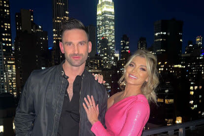 Lindsay Hubbard and Carl Radke on a balcony.