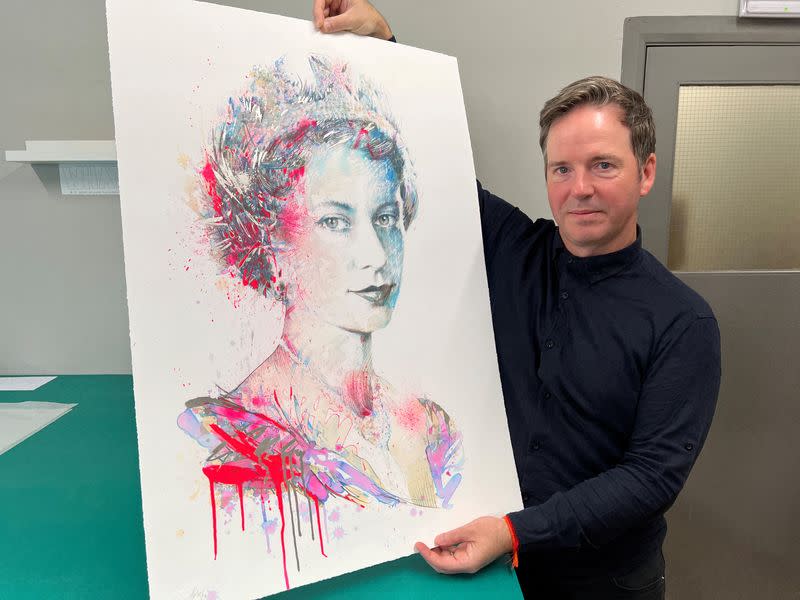 British artist Carne Griffiths poses with his work "The Platinum Queen" in London