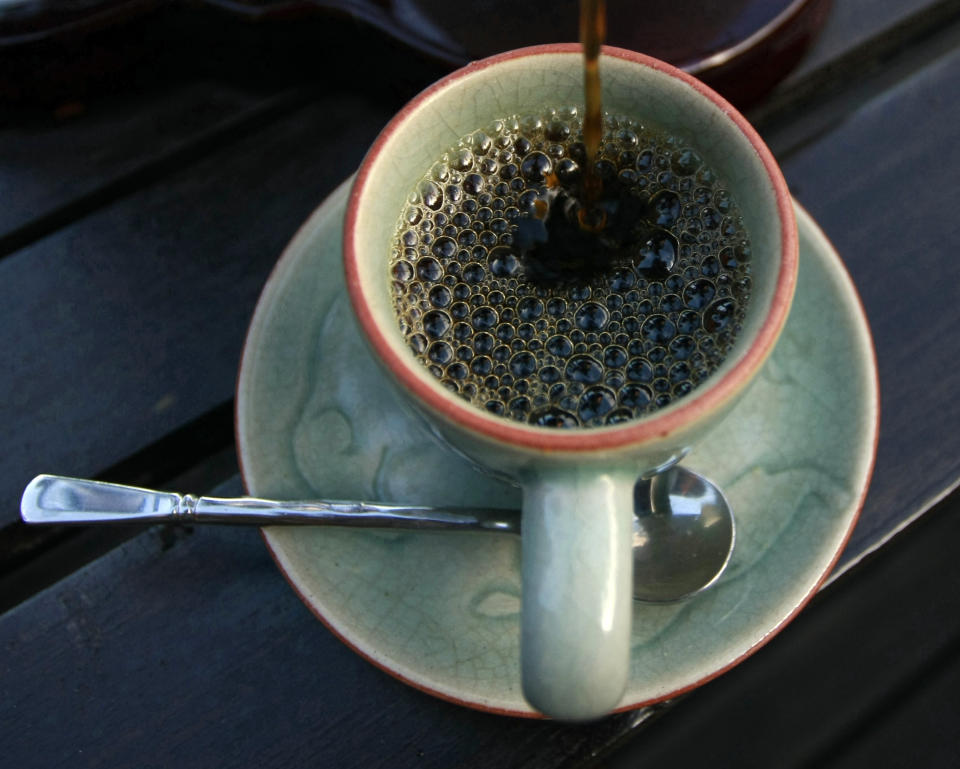 In this photo taken Dec. 3, 2012, the $1,100 per kilogram ($500 per pound) Black Ivory coffee is poured into a cup at a hotel restaurant in Chiang Rai province, northern Thailand. A Canadian entrepreneur with a background in civet coffee has teamed up with a herd of 20 elephants, gourmet roasters and one of the country's top hotels to produce the Black Ivory, a new blend from the hills of northern Thailand and the excrement of elephants which ranks among the world's most expensive cups of coffee. (AP Photo/Apichart Weerawong)