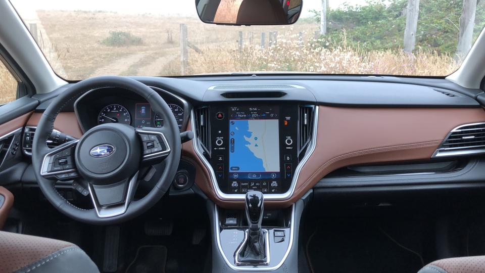 Subaru's DriverFocus uses an infrared camera hidden behind the dark space  above the navigation display.