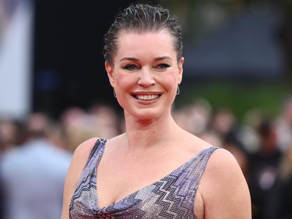 Rebecca Romijn in a silver dress