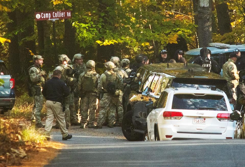 GARDNER - Mass. State Police troopers gather at the intersection of Kelton Street and Camp Collier Road as the search continues for Aaron M. Pennington Tuesday, October 24, 2023.