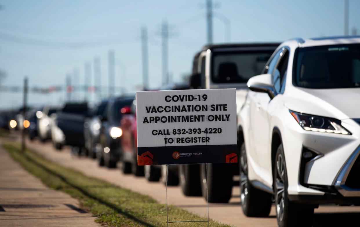 People who qualify under Phase 1A or Phase 1B of the state's guidelines wait for their turn to receive the COVID-19 vaccine on Sunday, Jan. 3, 2021, at a Houston Health Department's COVID-19 vaccine clinic in Houston, Tex. The department vaccinated 1,008 people who qualify under Phase 1A or Phase 1B of the state's guidelines at the clinic's first day on Saturday.