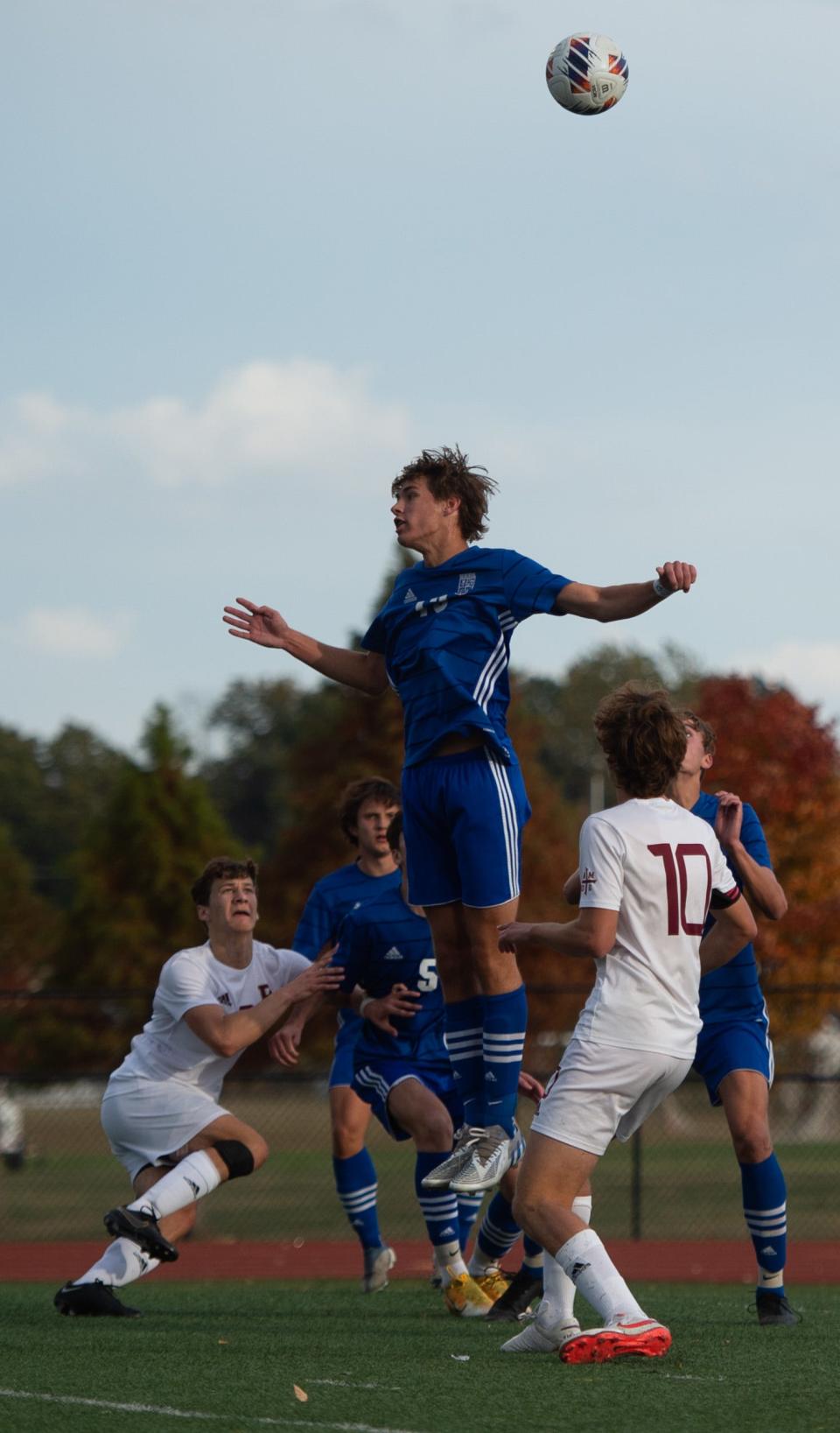 Memorial’s Connor Harding (13) heads the ball as the Memorial Tigers play the Brefeut Jesuit Braves for the 2A Boy’s Soccer Semi State game at Bundrant Stadium in Evansville, Ind., Saturday afternoon, Oct. 22, 2022.