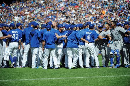 Aug 2, 2015; Toronto, Ontario, CAN; Toronto Blue Jays and Kansas City Royals players confrontation after relief pitcher Aaron Sanchez (41) pitches and hits Kansas City Royals short stop Alcides Escobar (2) (not in picture) and gets ejected by home plate umpire Jim Wolf in the eighth inning at Rogers Centre. Peter Llewellyn-USA TODAY Sports