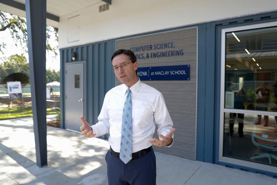 Maclay Head of School James Milford gives a rundown of the new Beck Family Research Center, a group of three classrooms made from recycled shipping containers, on the Maclay campus Wednesday, May 15, 2019. 