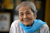 Daw Thein Khin, a 100-year-old woman survivor of the coronavirus disease (COVID-19) poses for a photo at her home in Yangon