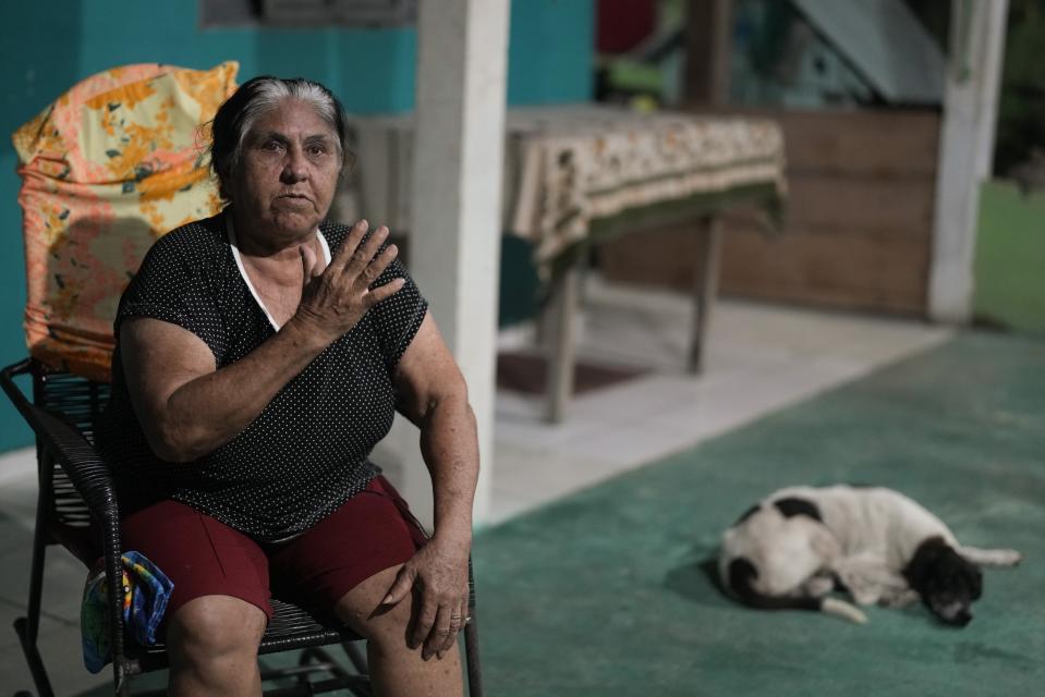 Settler Rosa Maria Lopes speaks during an interview with The Associated Press in Jaci-Parana, Rondonia state, Brazil, Wednesday, July 12, 2023. Her family lived in the reserve for over a century, but was driven out by cattle farmers. Where she grew up is now pasture. (AP Photo/Andre Penner)