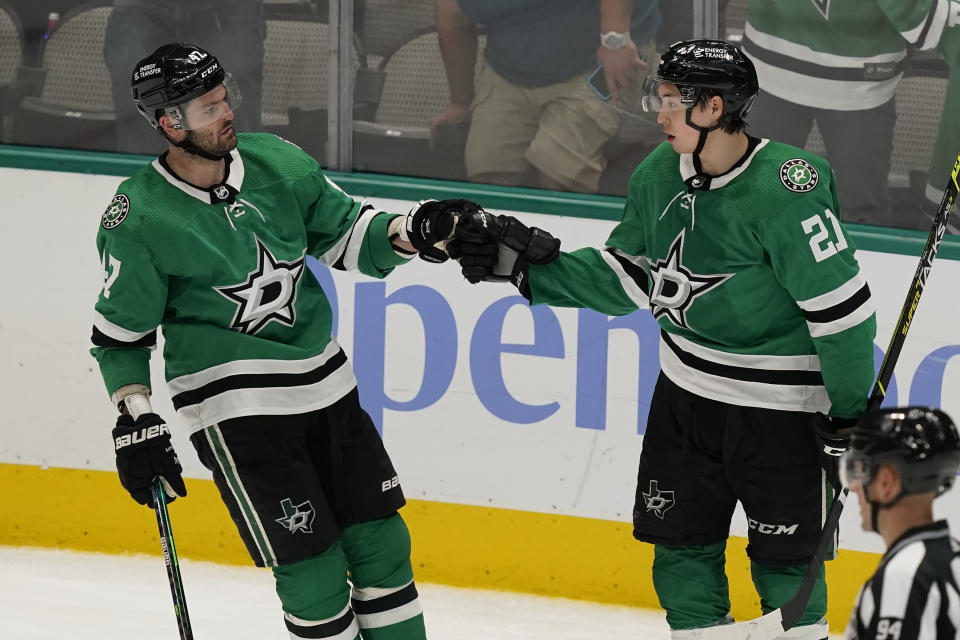 Dallas Stars left wing Jason Robertson (21) celebrates his goal right wing Alexander Radulov (47) during the third period of an NHL hockey game against the Anaheim Ducks in Dallas, Friday, April 29, 2022. The Stars won 4-2. (AP Photo/LM Otero)