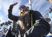 United States' Lindsey Vonn waves as she stands in the finish area after completing an alpine ski, women's World Cup super-G in Cortina D'Ampezzo, Italy, Sunday, Jan. 20, 2019. (AP Photo/Alessandro Trovati)