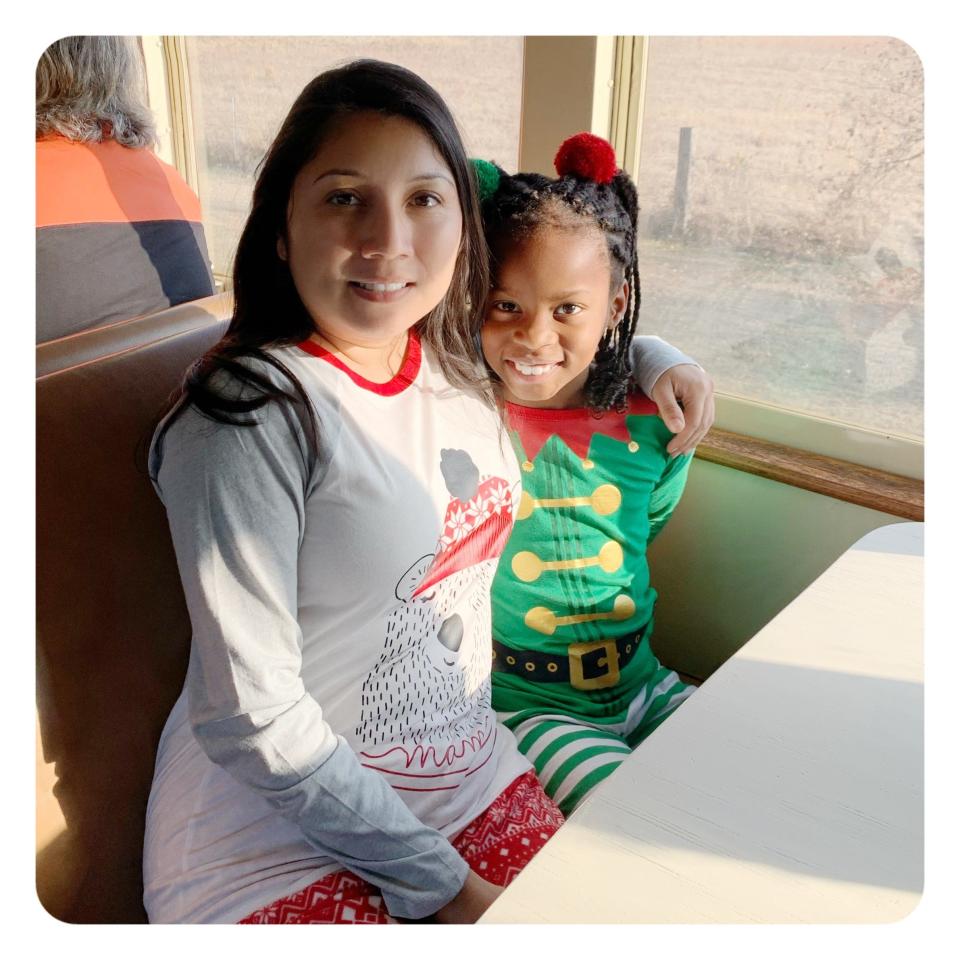 Lisa Garces, left, a senior vice president at DePelchin Children's Center in Houston, and her daughter, Sky, take a Polar Express holiday ride in 2020. This year, they are sponsoring a child as part of a DePelchin gift program that provides toys and games to children at the holidays.