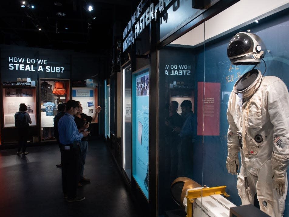 Visitors tour the new International Spy Museum in washington DC
