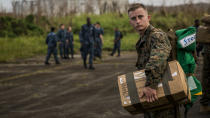 <p>U.S. Marine Corps Sgt. Cody M. Freeman, an aviation electrician assigned to the 26th Marine Expeditionary Unit (26th MEU), carries a box of supplies at Jose Aponte de la Torre Airport in Puerto Rico, Sept. 27, 2017. (Photo : Lance Cpl. Cody J. Ohira/U.S. Marine Corps via Getty Images) </p>
