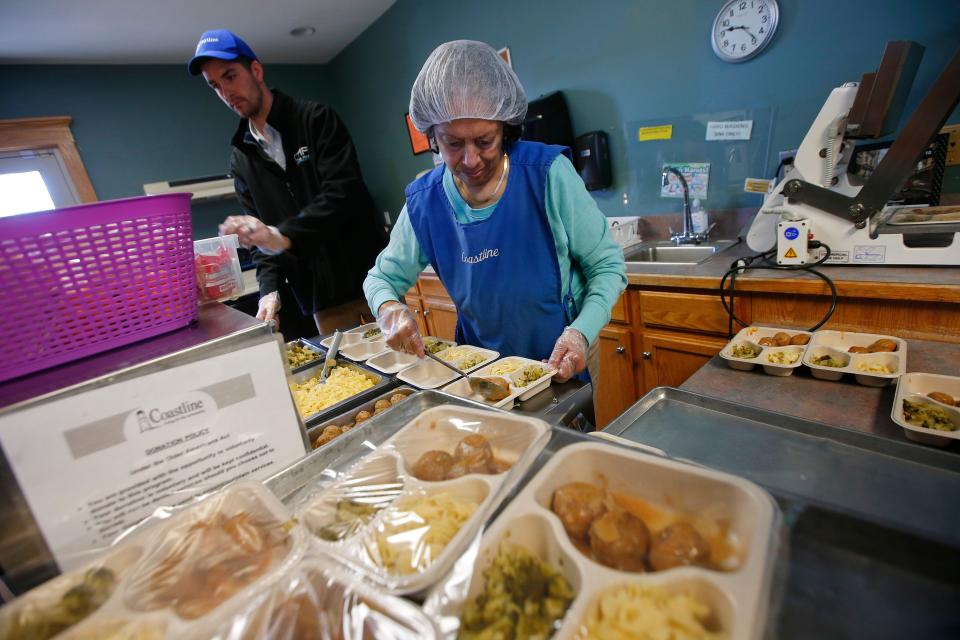 Scelena Combs prepares Swedish meatballs for the Coastline Elderly's Meals on Wheels program at the Senior Center at Brooklawn Park in New Bedford.