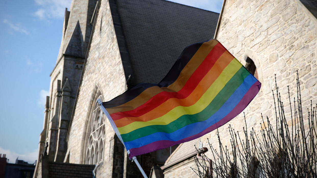  United Methodist Church with LGBTQ+ rainbow flag. 