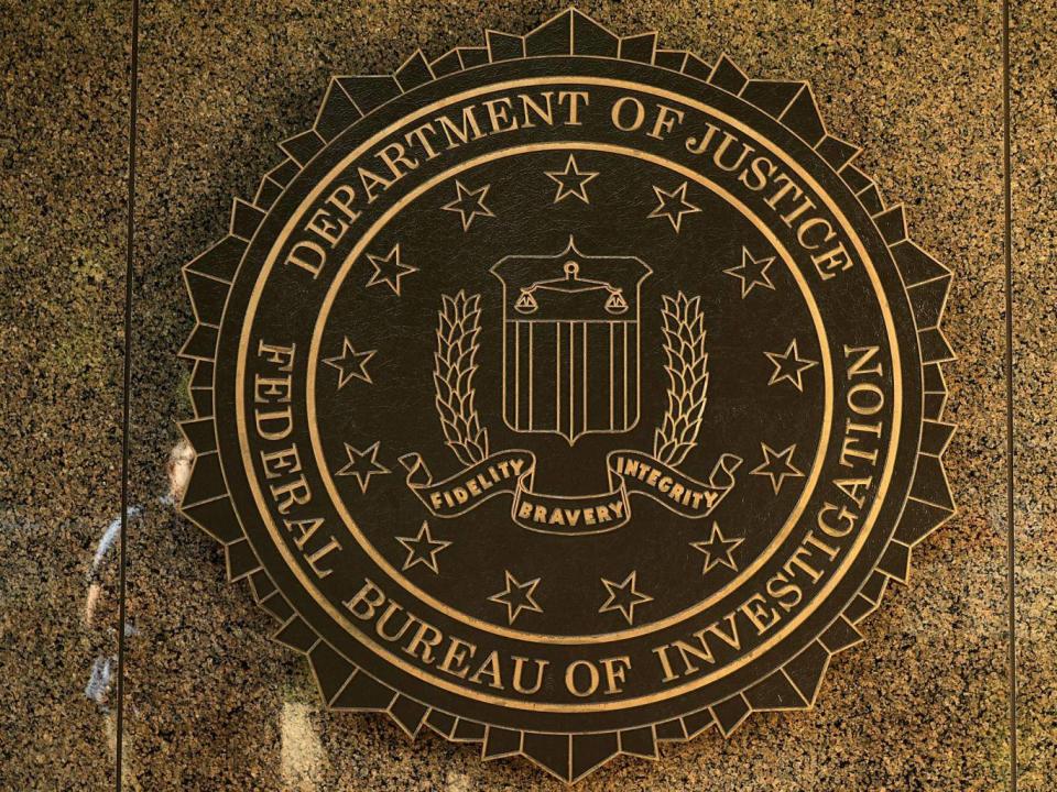 The seal of the Federal Bureau of Investigation hangs on the outside of the bureau's Washington, DC headquarters (Chip Somodevilla/Getty Images)