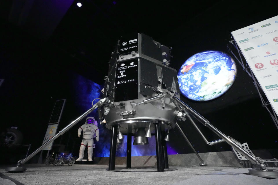 A model of the lander of HAKUTO-R private lunar exploration program is displayed prior to livestream of the lunar landing event Wednesday, April 26, 2023, at Miraikan, the National Museum of Emerging Science and Innovation, in Tokyo. Tokyo's ispace company put its own spacecraft into orbit around the moon a month ago. Flight controllers will direct the craft, named Hakuto, Japanese for white rabbit, to descend from 60 miles (100 kilometers) high and land on Wednesday. (AP Photo/Eugene Hoshiko)