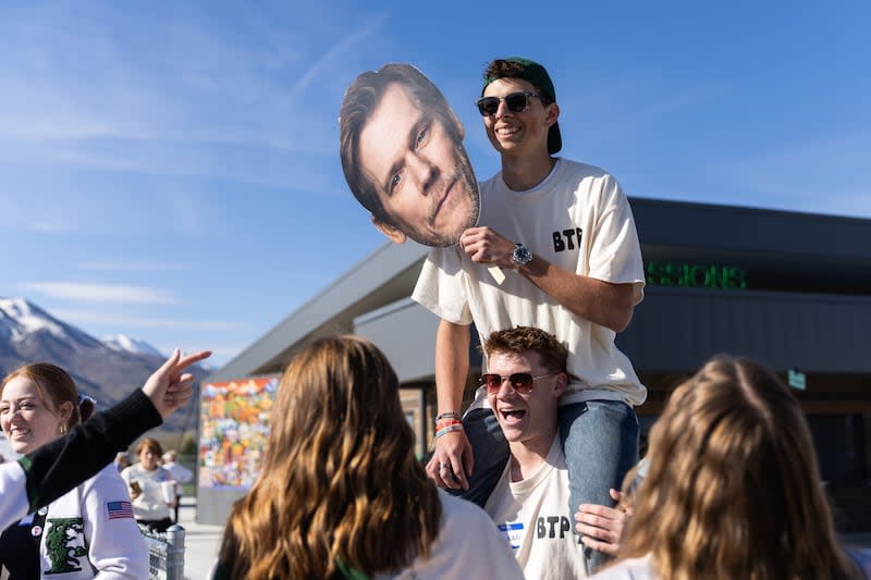 Evan Laker is carried by Isaac Cowie as students and community members welcome Kevin Bacon to Payson High School and partake in a community kit-building program with Bacon’s charity Six Degrees in Payson on Saturday April 20, 2024. | Marielle Scott, Deseret News