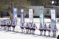 Members of the Colorado Avalanche walk to the rink to play the Vegas Golden Knights in the Lake Tahoe Outdoor NHL hockey game at Stateline, Nev., Saturday, Feb. 20, 2021. (AP Photo/Rich Pedroncelli))