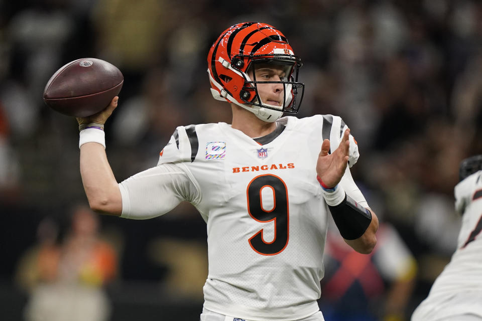 Cincinnati Bengals quarterback Joe Burrow (9) looks to pass against the New Orleans Saints during the first half of an NFL football game in New Orleans, Sunday, Oct. 16, 2022. (AP Photo/Gerald Herbert)