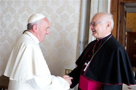 Pope Francis meets Archbishop Robert Zollitsch (R), head of the German bishops' conference, during a private audience at the Vatican October 17, 2013. REUTERS/Osservatore Romano