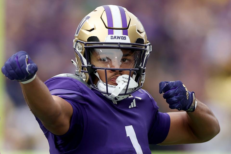 SEATTLE, WASHINGTON - OCTOBER 14: Rome Odunze #1 of the Washington Huskies celebrates a reception against the Oregon Ducks during the first quarter at Husky Stadium on October 14, 2023 in Seattle, Washington. (Photo by Steph Chambers/Getty Images)