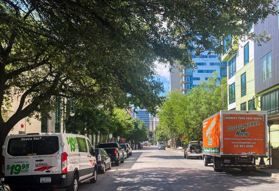 Moving trucks line a street near the University of Texas in Austin as students prepare for the start of the school year. Rents for off-campus housing are up nationwide; in Austin, they’re 20% higher than a year ago.