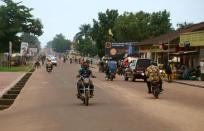 A motorcyclist rides along the main street in Mbandaka, Democratic Republic of Congo May 19, 2018. REUTERS/Kenny Katombe