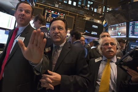 Traders work on the floor before the NYSE Opening Bell in New York October 13, 2014. REUTERS/Darren Ornitz