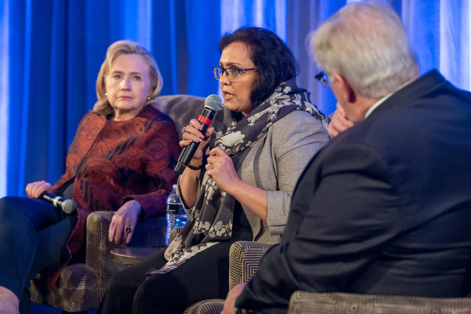 Women's rights advocate Roshan Mashal, center, and Hillary Clinton receive awards from Refugees International, a nonprofit organization promoting human rights for refugees, on May 11. (Laurence L. Levin / Refugees International)