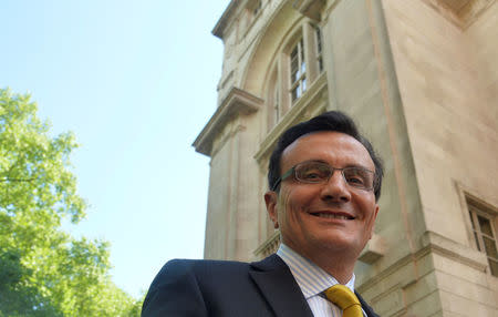 Chief Executive of AstraZeneca Pascal Soriot smiles as he leaves a television studio at Millbank in London May 13, 2014. REUTERS/Toby Melville/File Photo