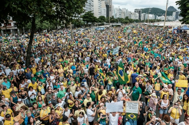 People take part in a nation-wide protest against corruption at Copacabana beach in Rio de Janeiro, Brazil, on December 4, 2016