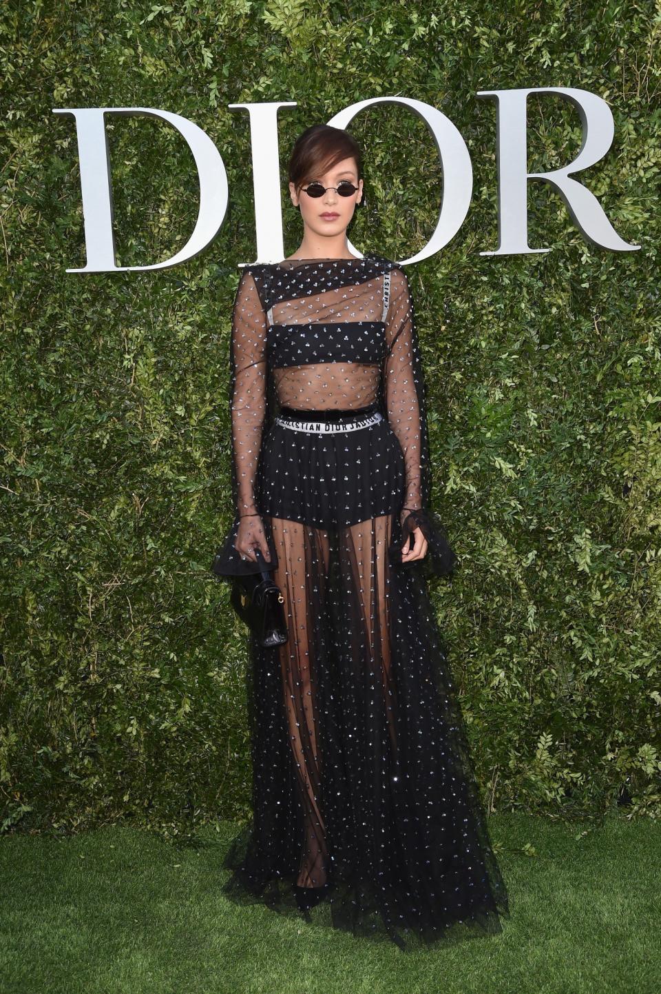 <p>This was one of Bella’s more covered-up Dior looks and the semi-sheer gown definitely worked.<br><i>[Photo: Dior]</i> </p>